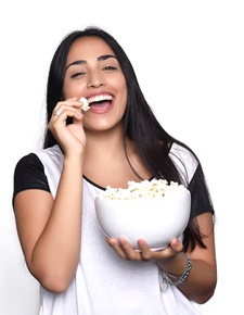 Woman eating popcorn