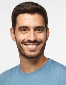 Man smiling during Invisalign treatment