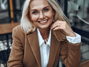 Woman with dental bridge smiling