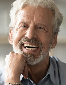 A smiling man happy with his dentures