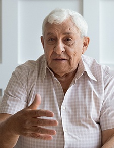An older man speaking