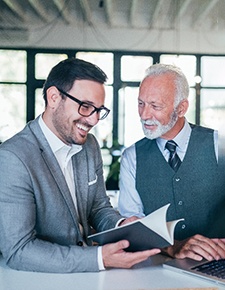 An older man working with a client