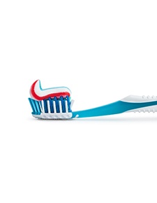 Close-up of toothbrush with dab of toothpaste