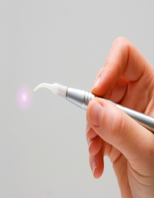 Hand holding a LightWalker laser dentistry tool