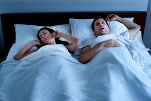 Woman can't sleep next to snoring man in need of Night Lase