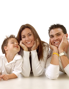 Family smiling after receiving dental services