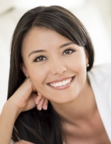 Woman with porcelain veneers smiling