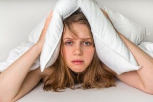 tired woman with pillow
