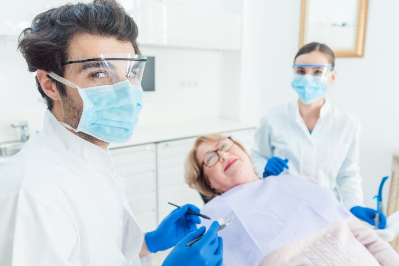 Dentist in Friendswood wearing PPE