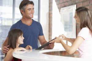 woman learning about dental financing options