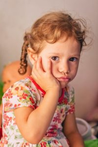 Young girl with a toothache